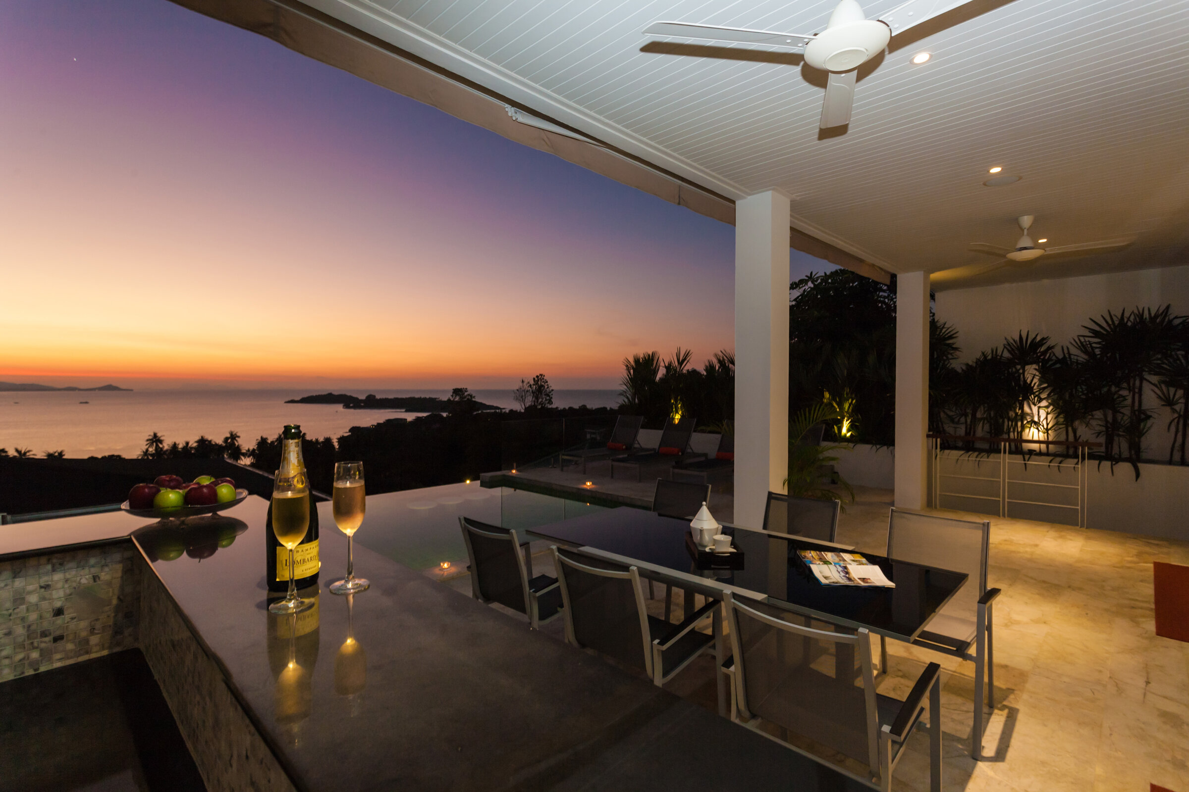 Villa Daizo open-plan living, dining and kitchen with sunset views